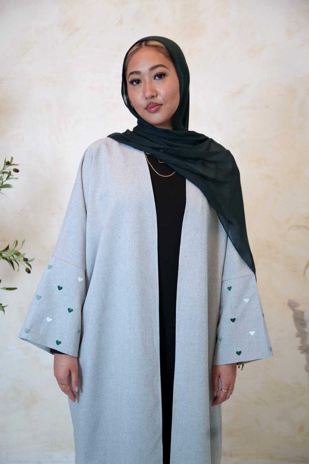 a woman wearing a Forest Green Modal Hijab