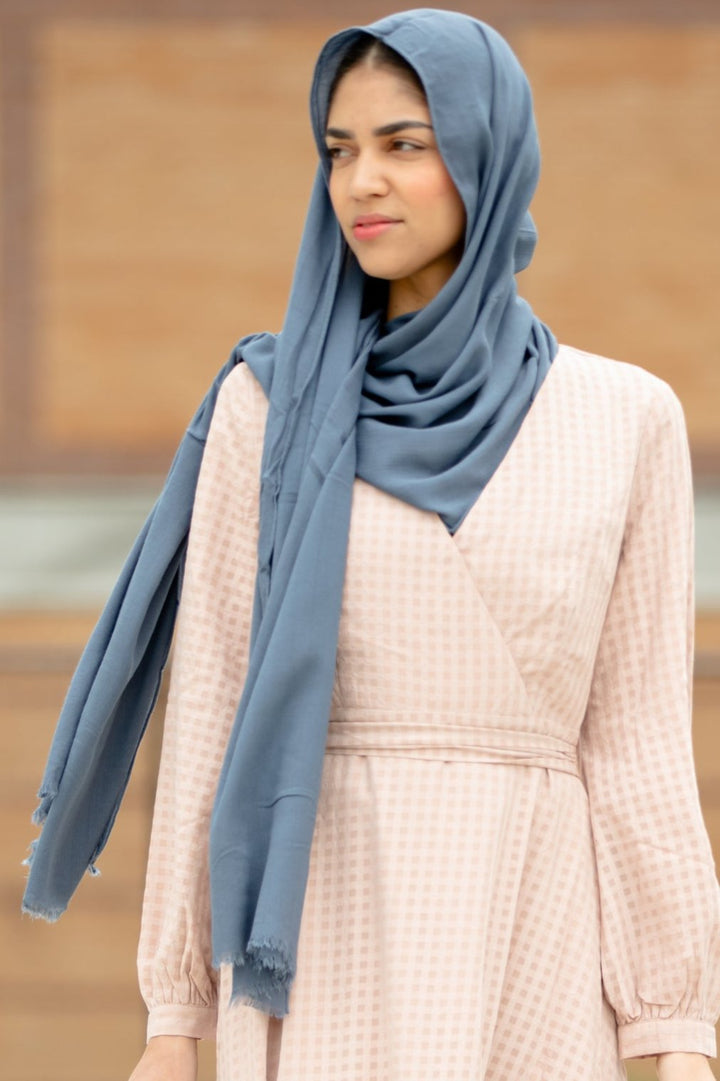 Woman wearing Grey Modal Fringe Edge Hijab from Urban Modesty, showcasing lightweight and premium modal fabric with fringe details.