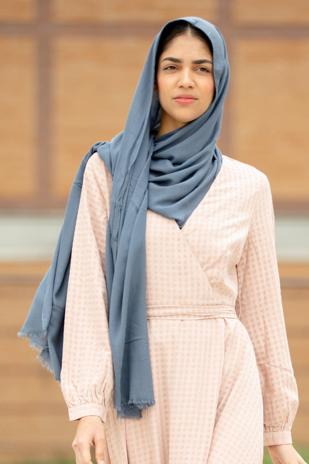 Woman wearing Grey Modal Fringe Edge Hijab from Urban Modesty collection, showcasing the premium modal fabric and elegant design.