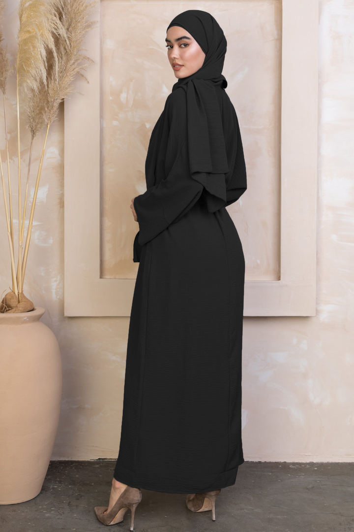 Black modest dress with hijab in four-piece abaya set