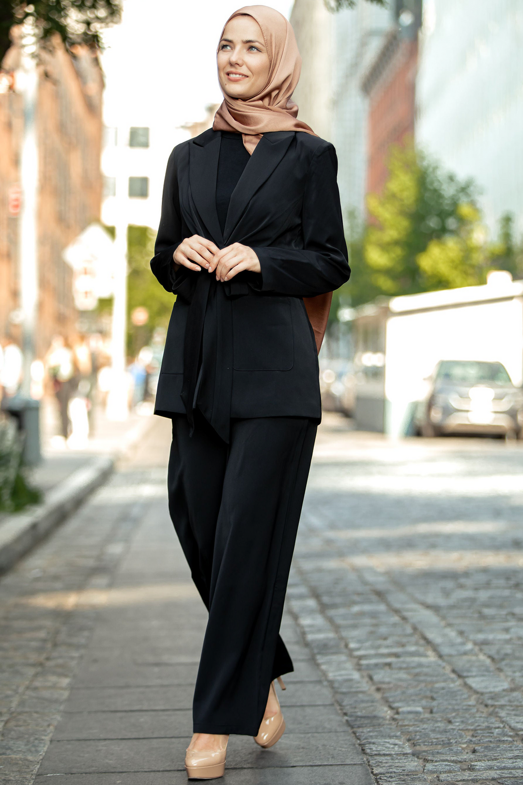 Woman in black pantsuit and hijab for suit set