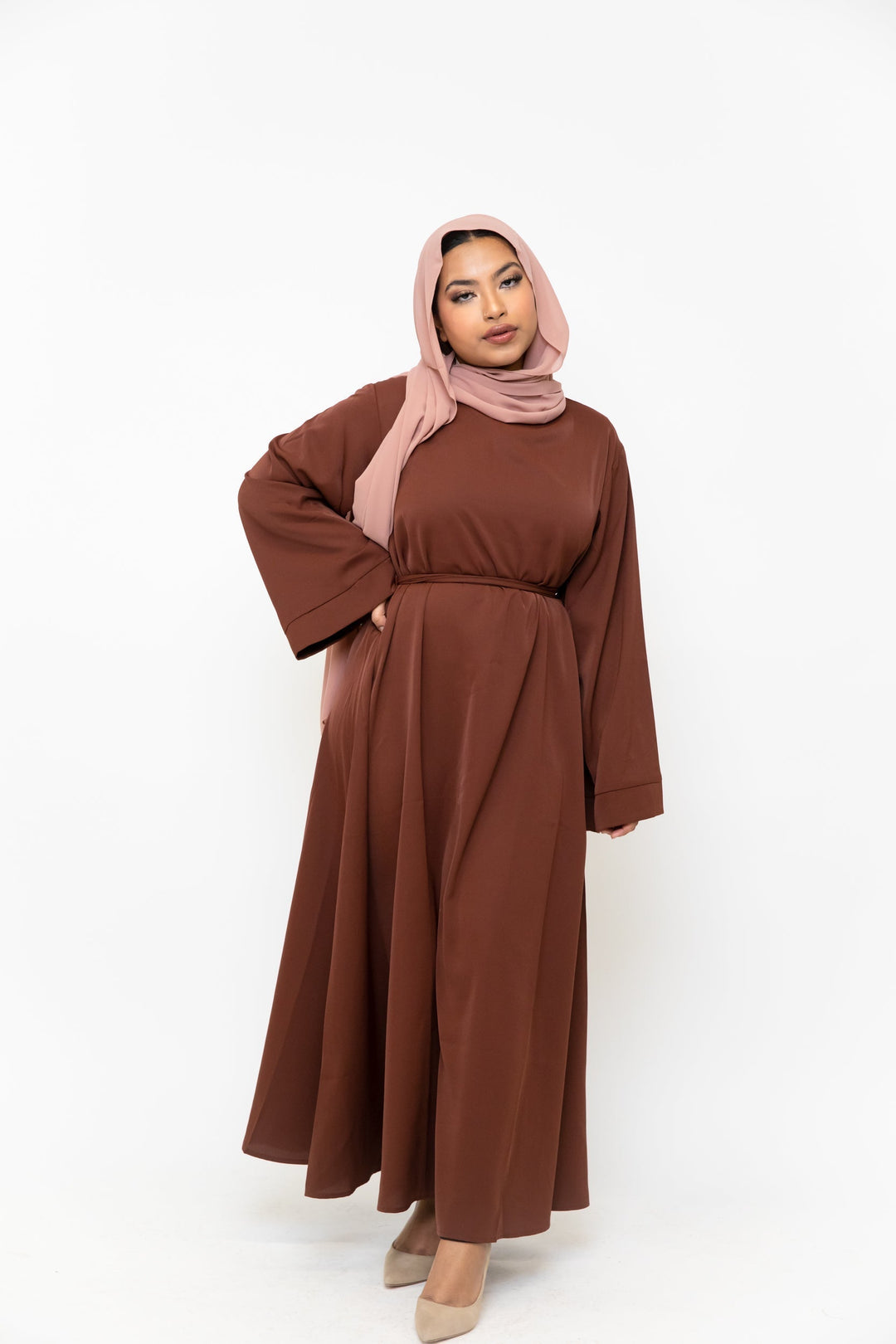 Woman in pink hijab wearing brown kimono sleeve abaya maxi dress