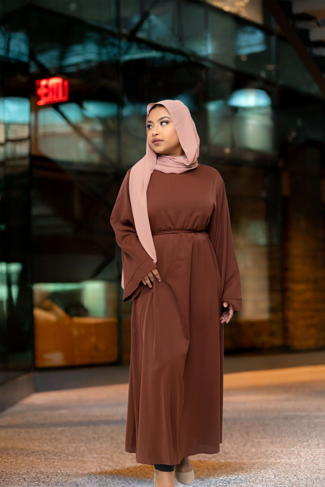 Woman in brown kimono sleeve abaya maxi dress and hijab
