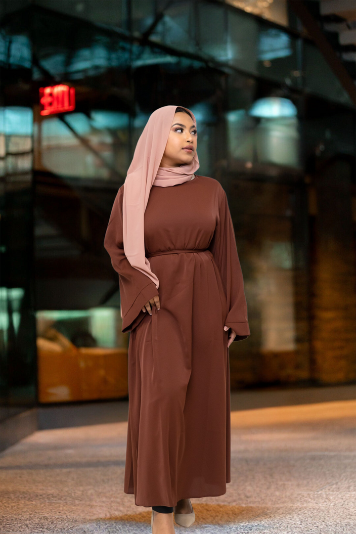 Woman in brown hijab and kimono sleeve abaya maxi dress