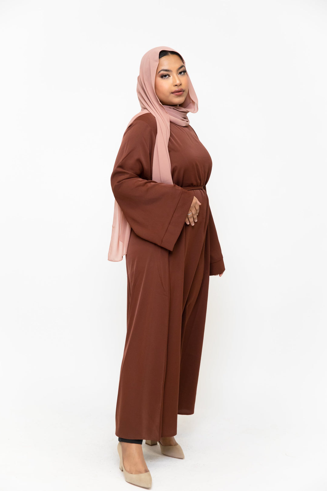 Woman in pink hijab wearing brown kimono sleeve abaya maxi dress
