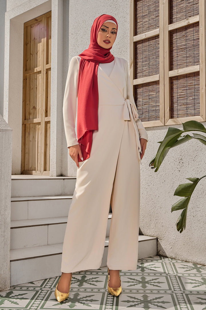 Woman in cream side knot modest fashion jumpsuit