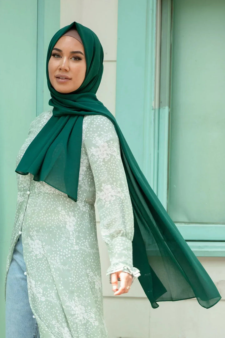 Woman wearing Forest Green Chiffon Hijab, showing lightweight and sheer texture, ideal for any occasion.