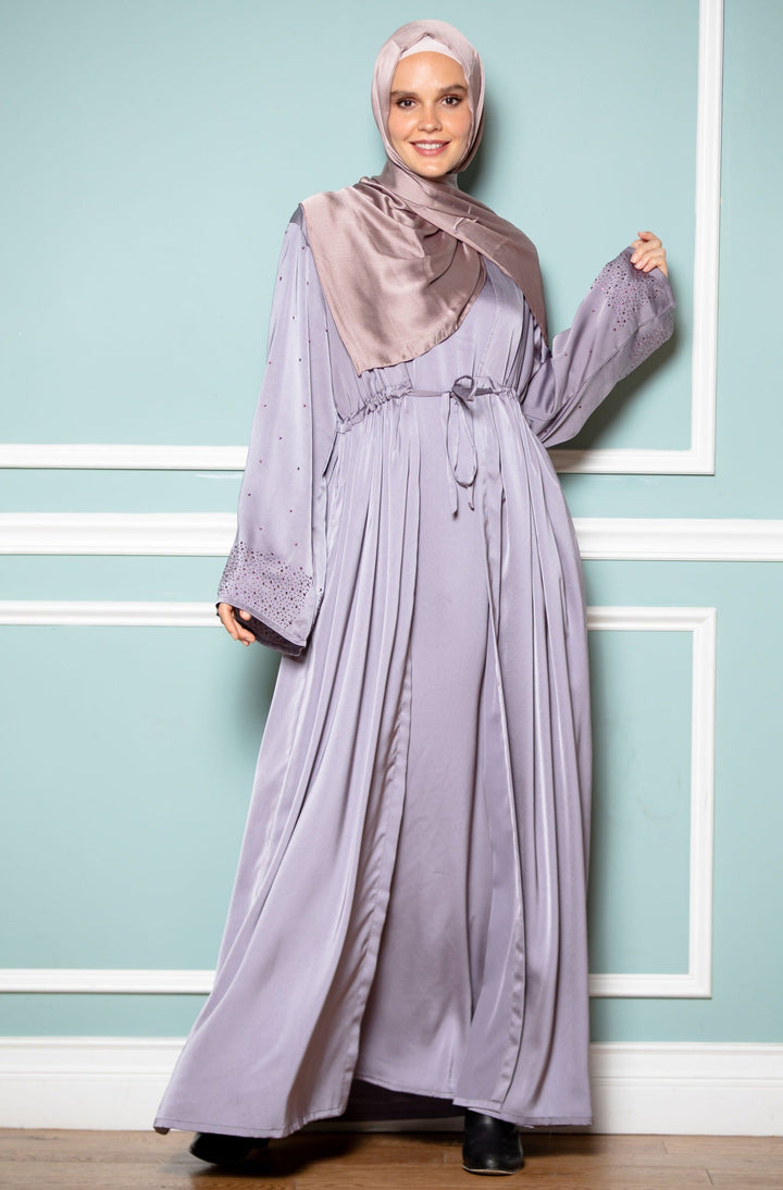 Woman in lilac satin abaya and hijab, gray drawstring open front style