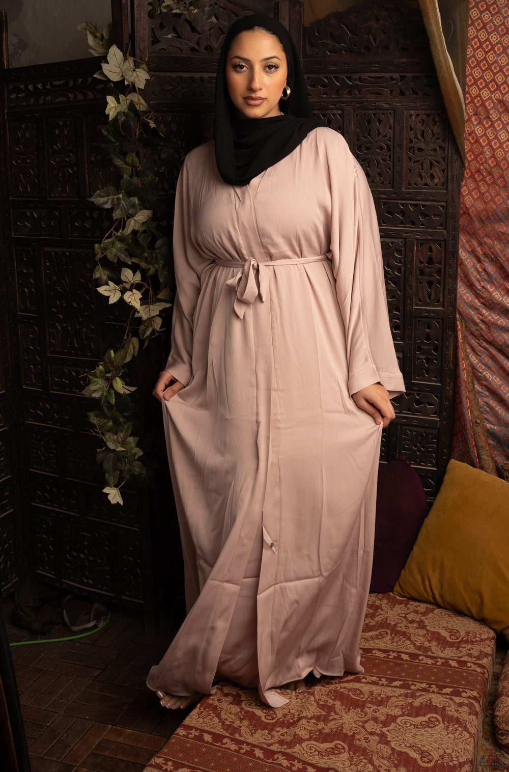 Woman wearing a Khaki Sleeveless Dress and Open Abaya Set with a belt, featuring a flowy A-Line silhouette made of premium polyester fabric.