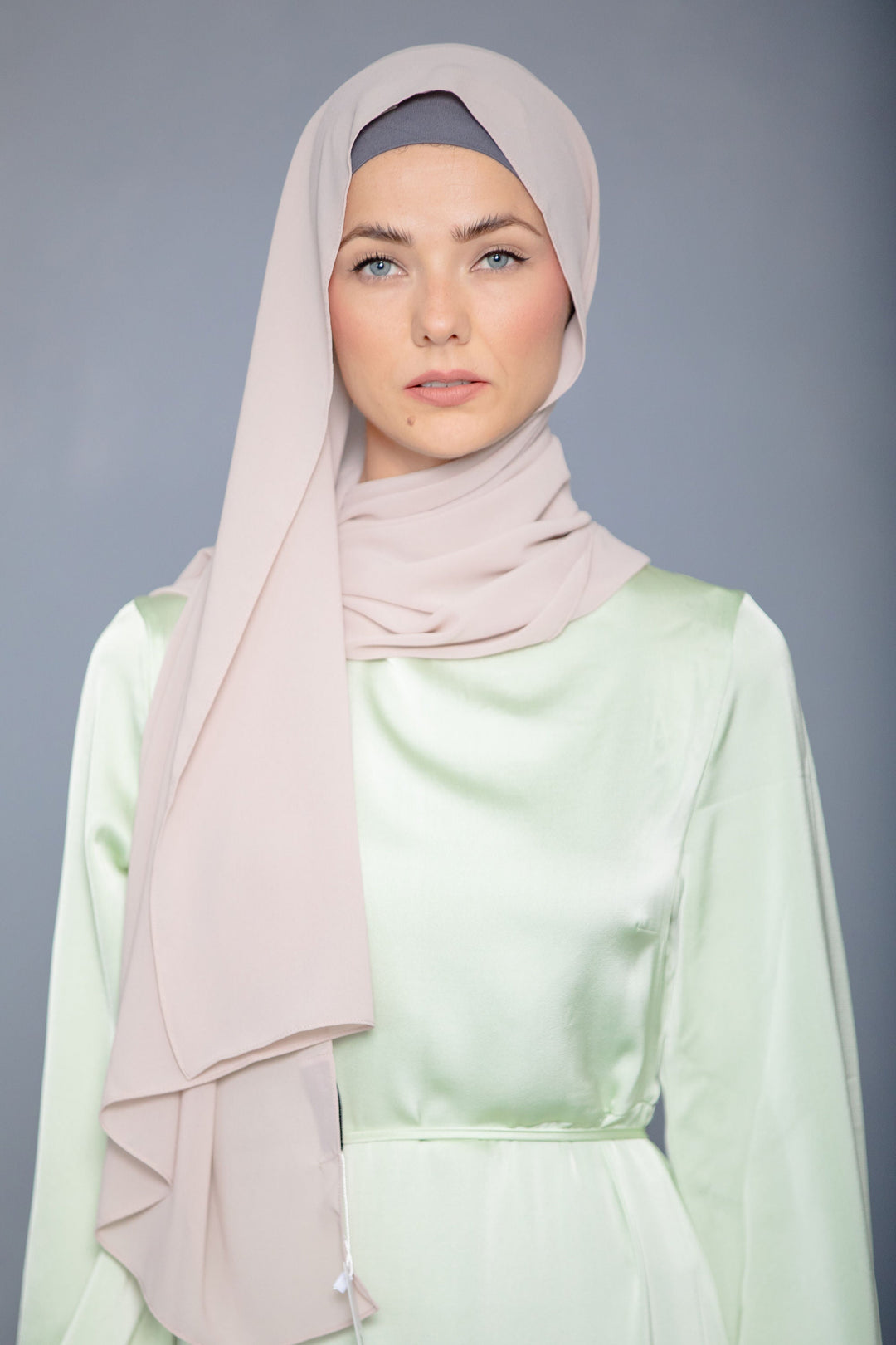 Woman in Latte Chiffon Hijab and light green dress