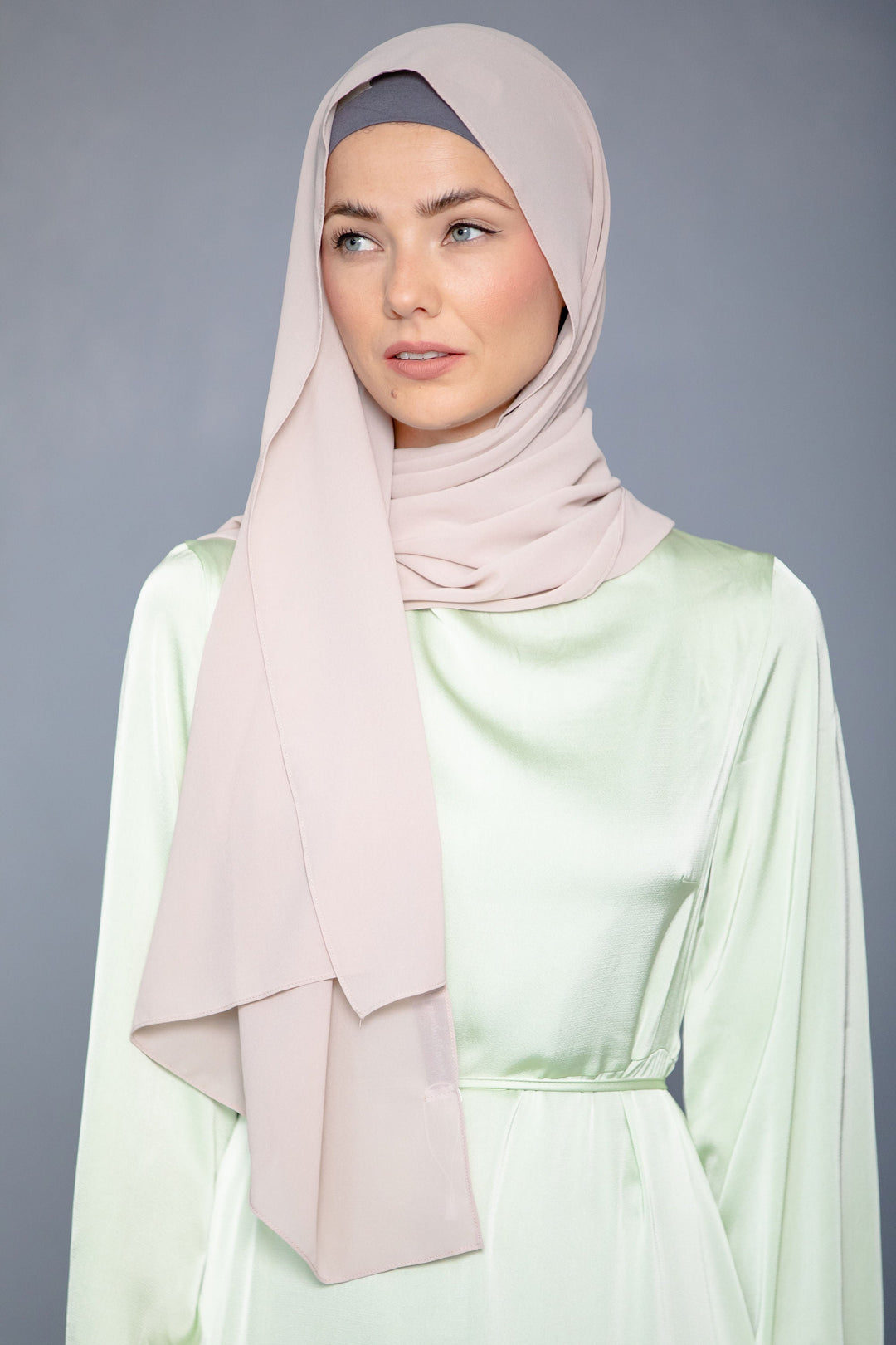 Woman in light pink Latte Chiffon Hijab and light green dress