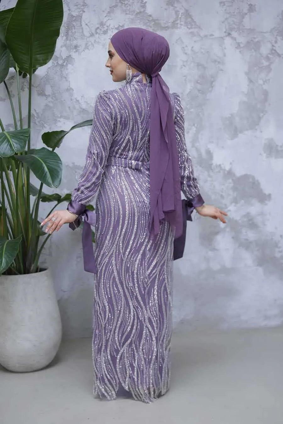 Lilac Beaded Gown featuring intricate detailing and a slim fit silhouette, showcasing elegance and luxury in a timeless design.