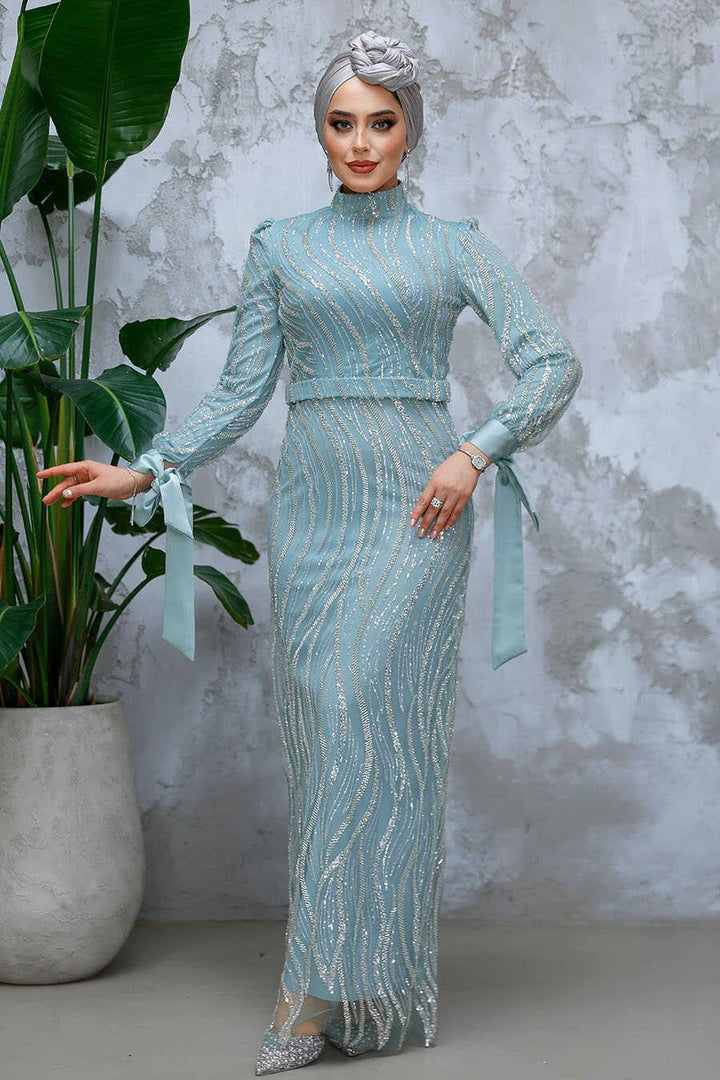Elegant model wearing a Mint Beaded Gown with intricate beading, crew neckline, and a sophisticated silhouette. Perfect for a regal event.