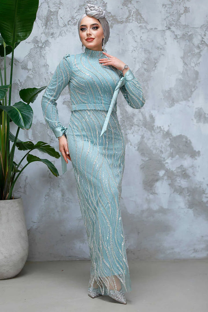 Luxurious Mint Beaded Gown with intricate detailing from Urban Modesty displayed on model, showcasing elegance and style.