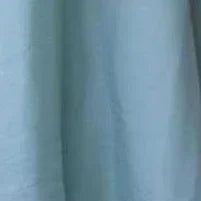 Close-up view of fabric of Mint Blue Organza Criss Cross Gown, highlighting the luxurious texture and elegant color.