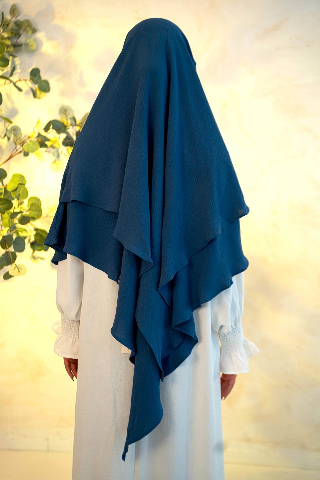 Navy Blue Double Layer Khimar worn over white dress, modest and fashionable, perfect for prayers or mosque visits, long-lasting and comfortable.