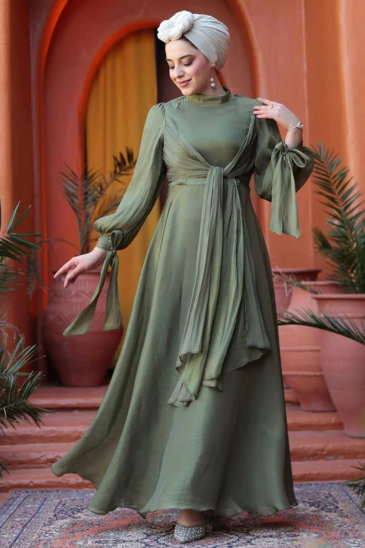 Olive Green Organza Criss Cross Gown with fit and flare silhouette, perfect for an elegant and regal appearance at formal events.