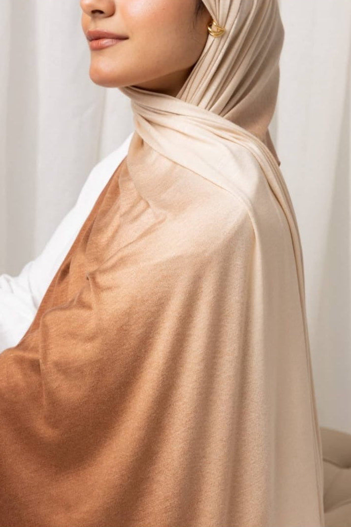 Woman wearing lightweight Ombré Jersey Hijab in brown and beige hues, perfect for easy and effortless draping.