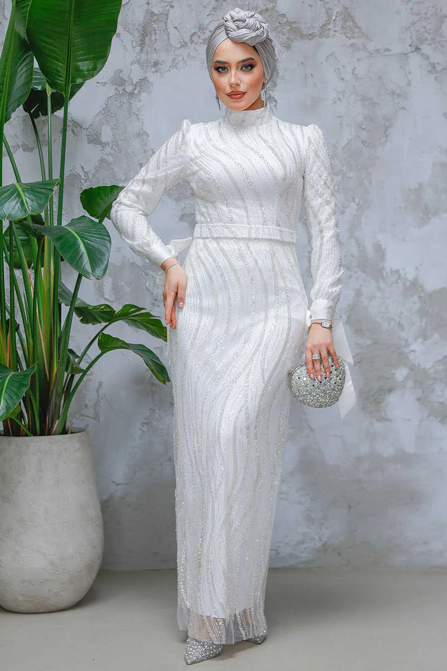 White Beaded Gown with elegant beaded details and crew neckline from Urban Modesty, showcasing a regal look for special events.