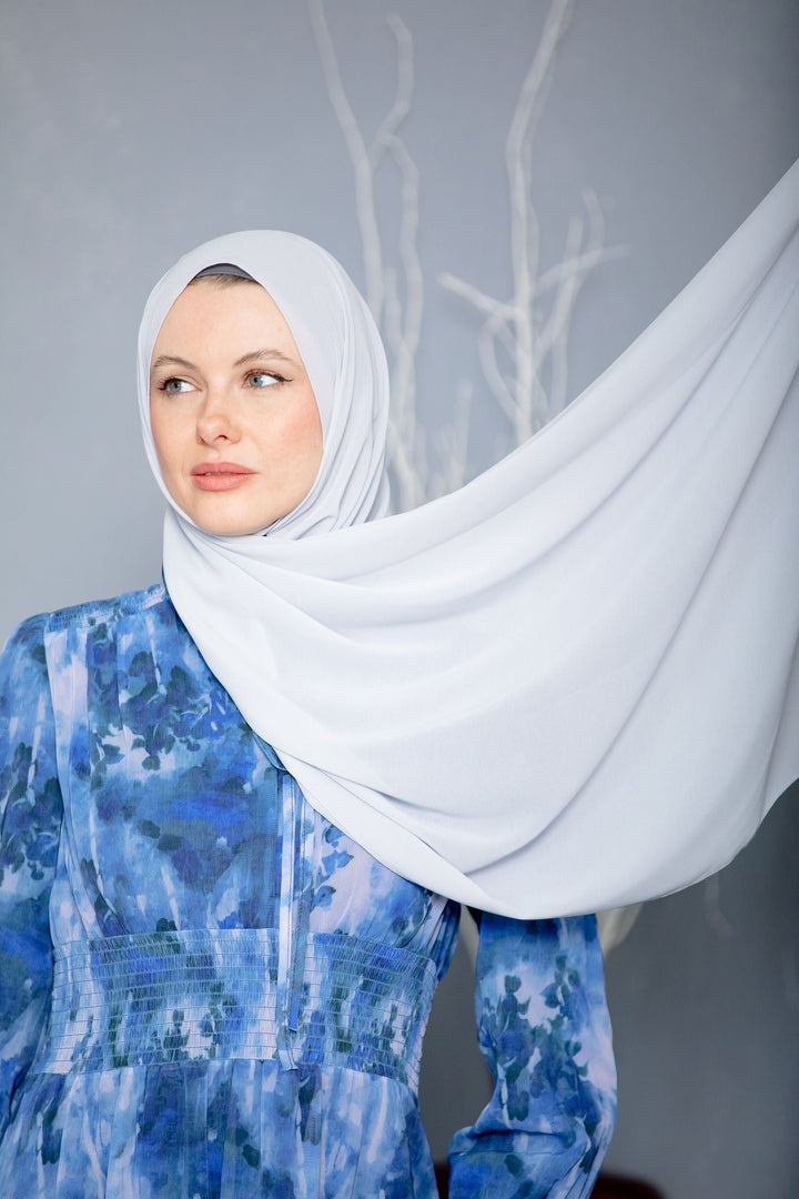 Woman in hijab and blue dress wearing White Chiffon Hijab