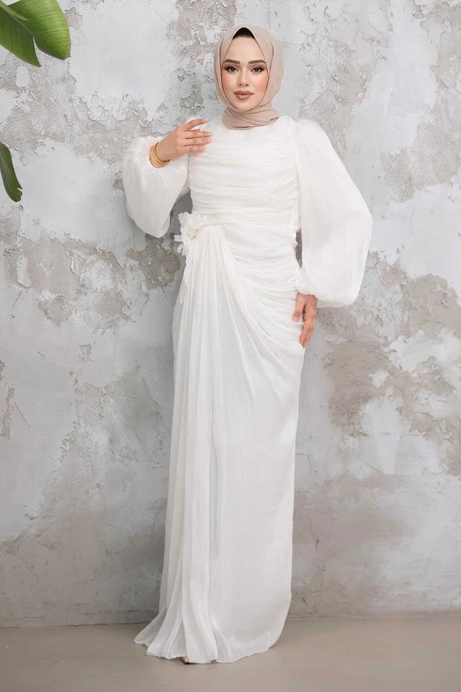 Woman in premium White Organza Side Drape Gown with side knot detailing, fit and flare silhouette, crew neckline, and elegant design.