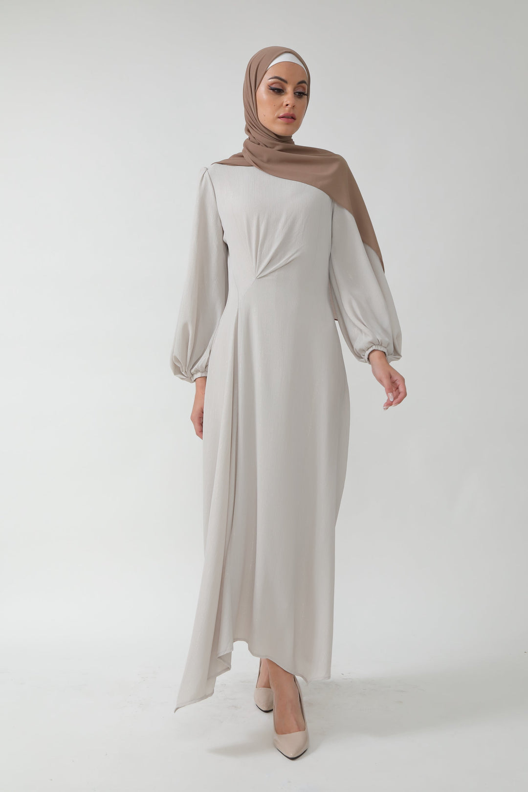 Woman in a Beige Metallic Pinstripe Long Sleeve Maxi Dress with a hijab