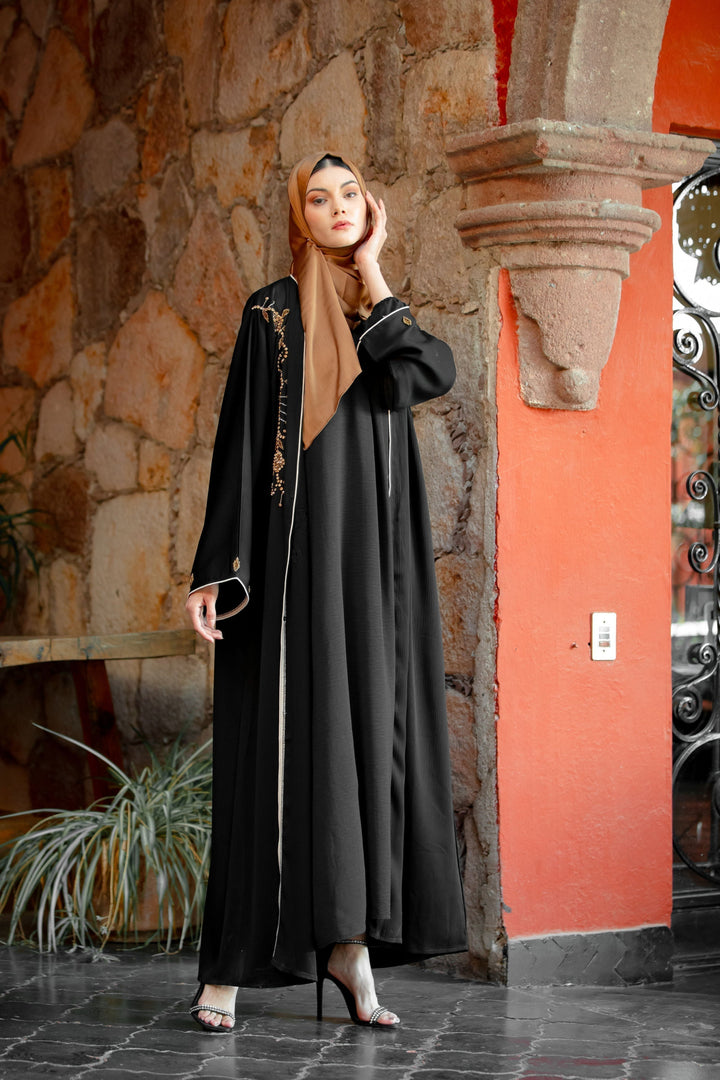 Elegant black beaded button down open front abaya with stunning gold embroidery