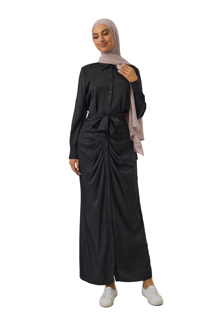 Woman in long-sleeved black dress and hijab from Black Button Down Shirt and Skirt Set