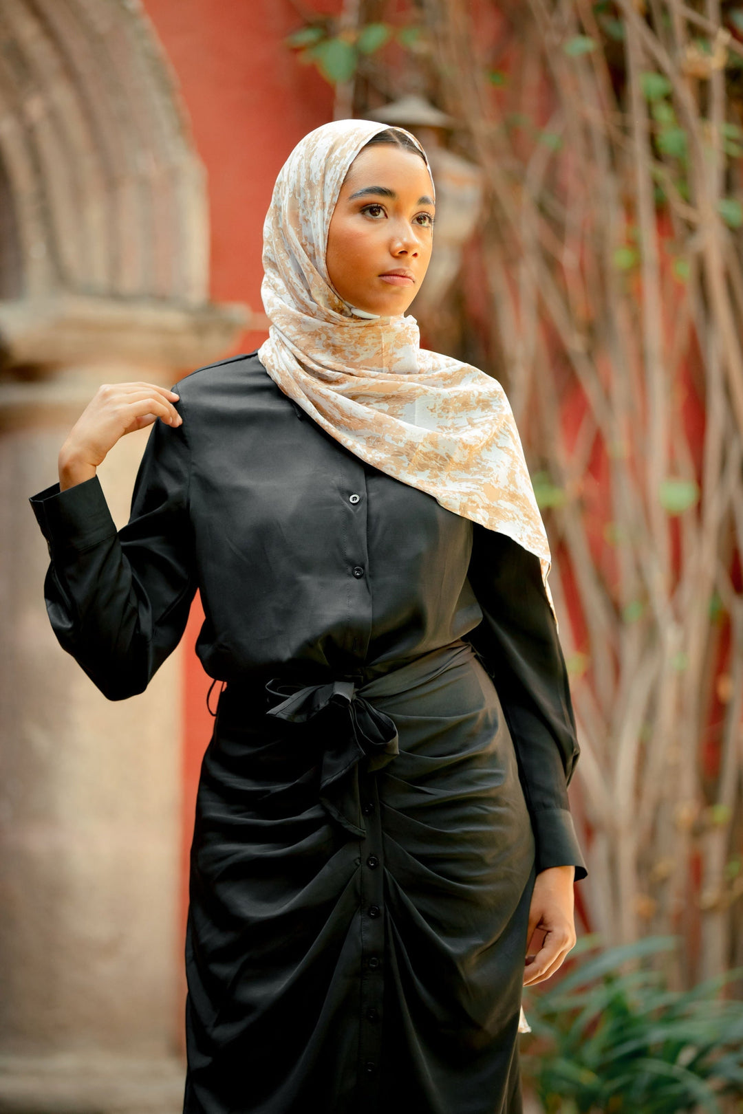 Woman in black dress and patterned hijab showcasing Black Button Down Shirt and Skirt Set