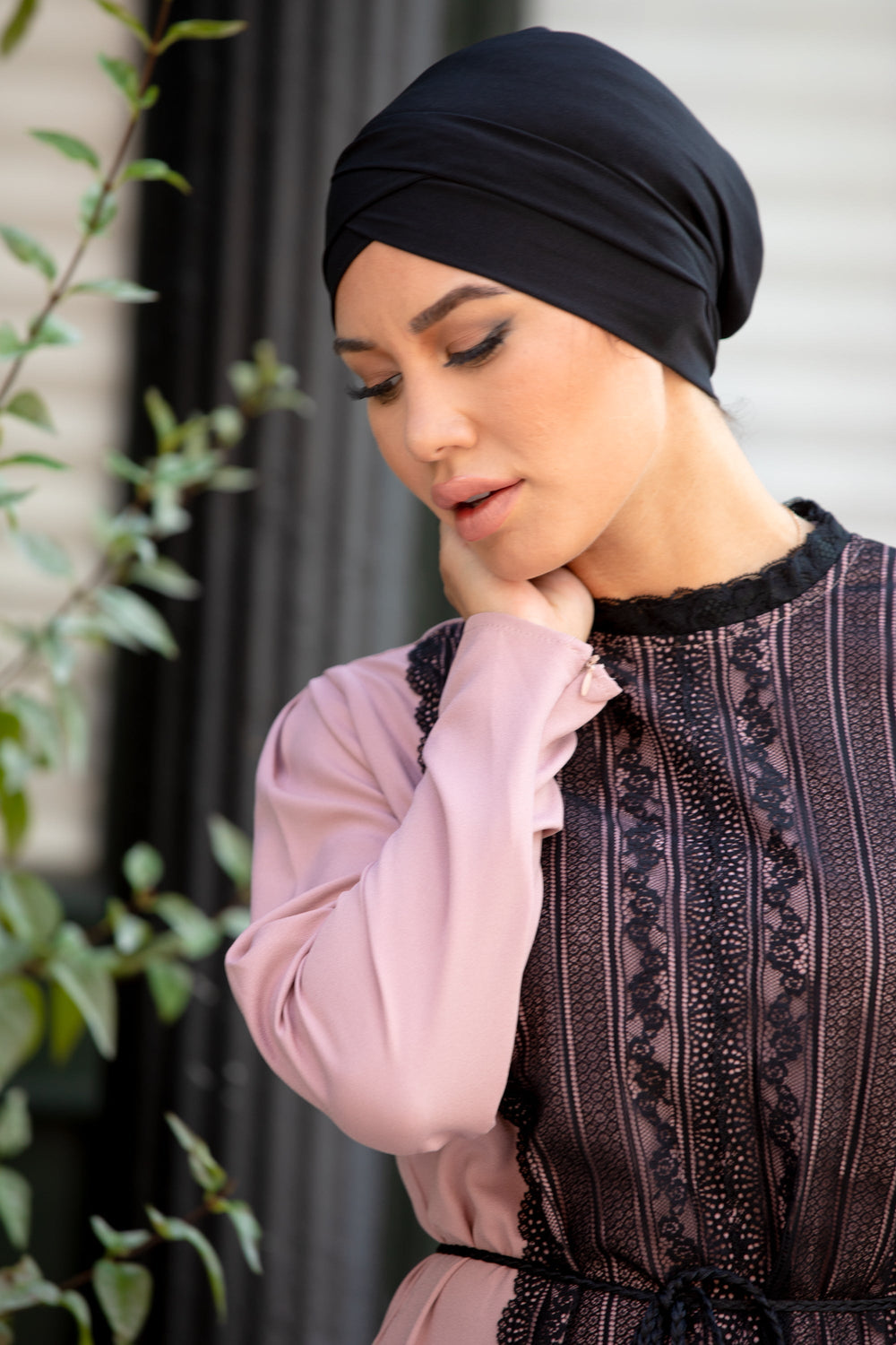 Woman wearing Black Criss-Cross Cap Hijab UnderScarf with pink and black lace dress