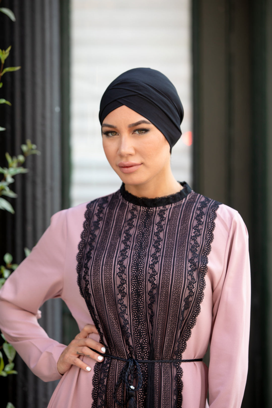 Woman in a pink dress wearing a Black Criss-Cross Cap Hijab UnderScarf with lace