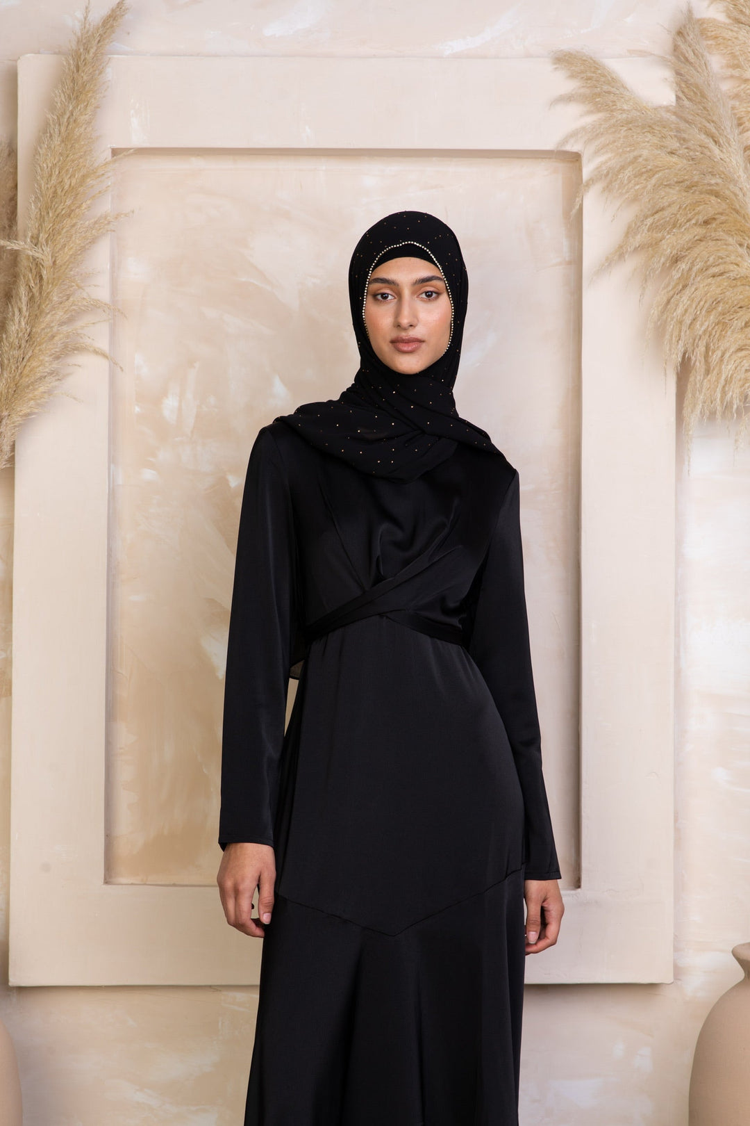 Elegant black criss cross satin maxi dress with hijab features a cross wrap waist