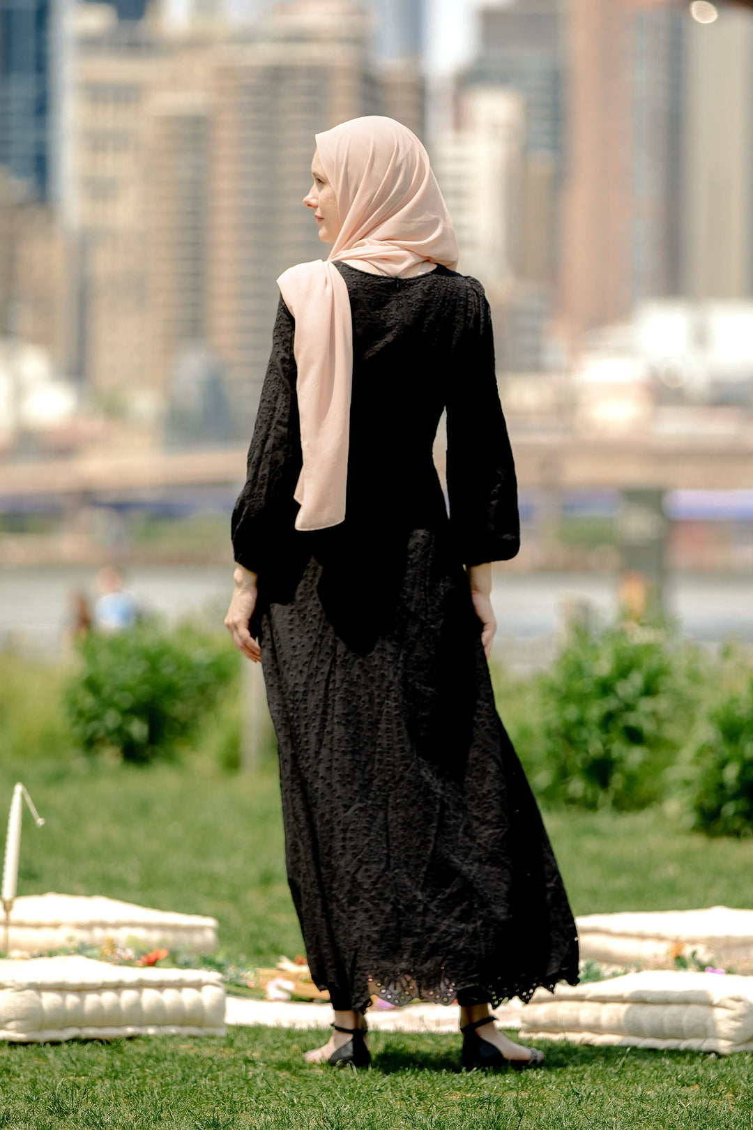 Woman in black hijab wearing a Black Eyelet Long Sleeve Maxi Dress