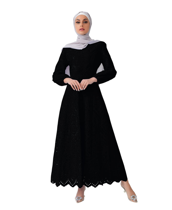 Woman in black dress and hijab wearing a Black Eyelet Long Sleeve Maxi Dress