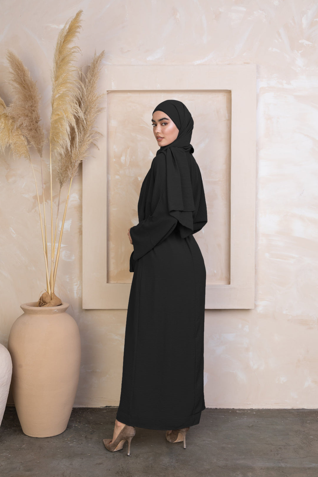 Black modest dress with hijab from the Black Four Piece Open Abaya Set