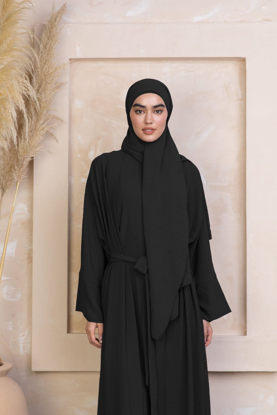 Black modest dress with hijab from the Black Four Piece Open Abaya Set