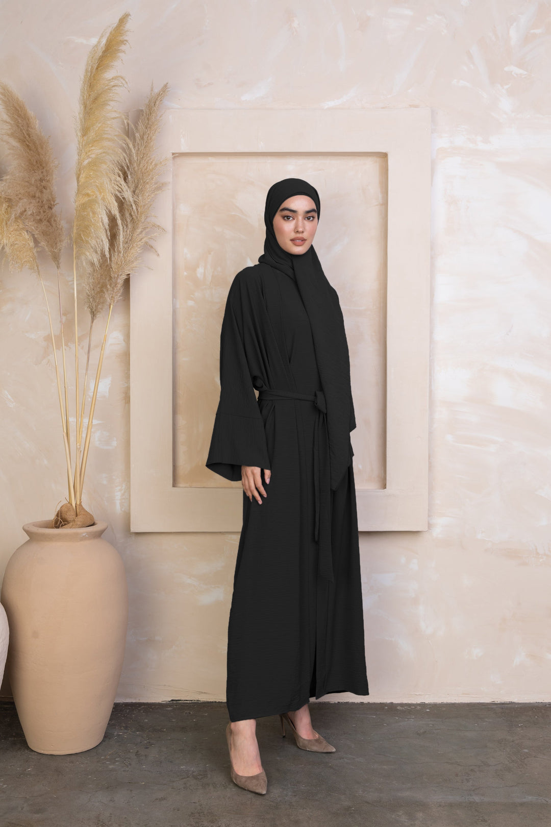 Black Four Piece Open Abaya Set featuring a stylish open design and matching hijab