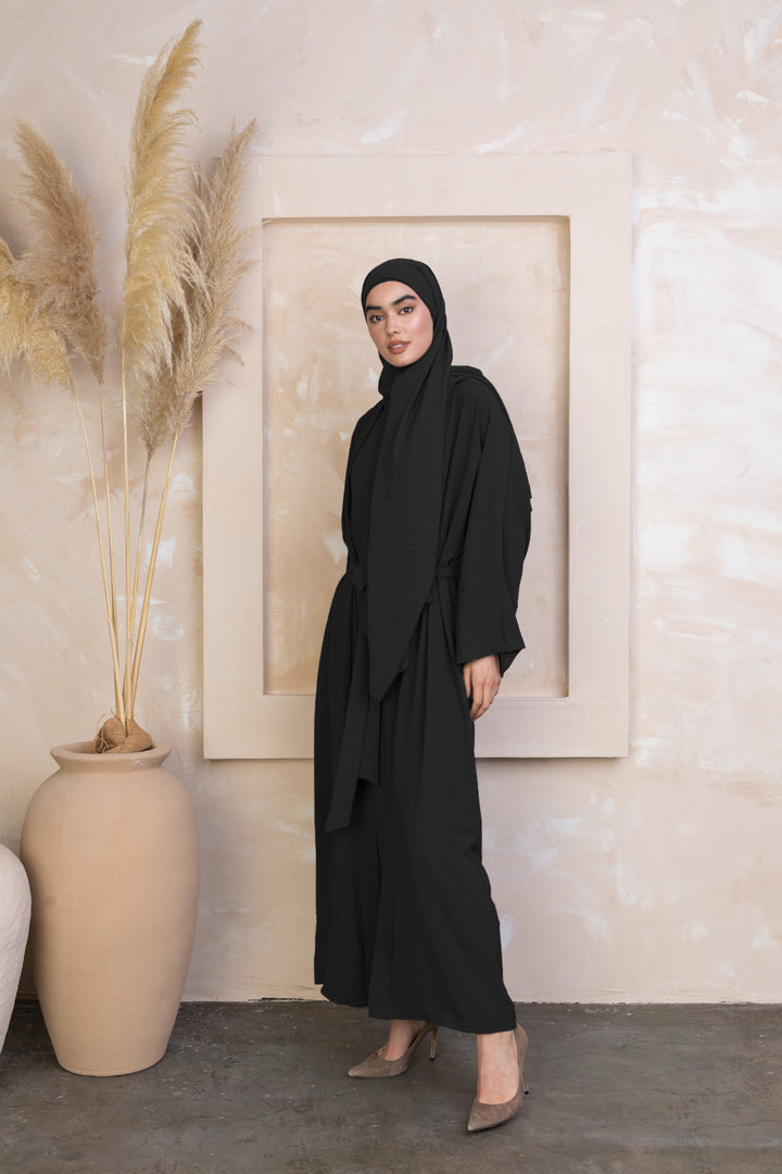 Black Four Piece Open Abaya Set showcasing a modest dress with hijab