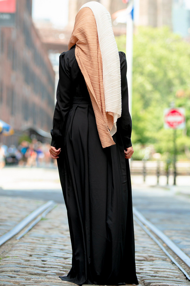 Woman in black dress and hijab showcasing the Black Lattice Abaya Maxi Dress