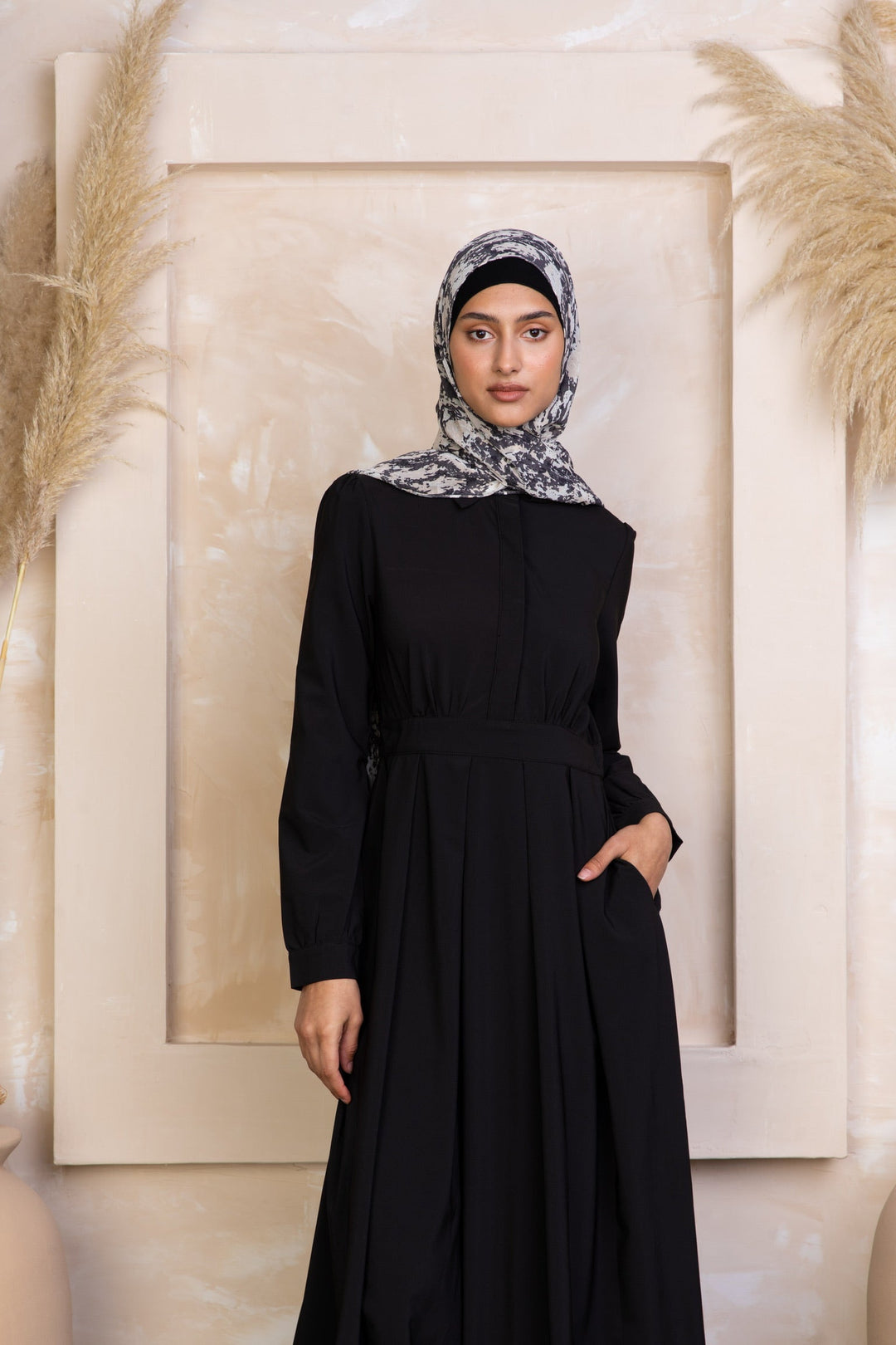 Black lattice abaya with patterned hijab, perfect for modest style and elegance