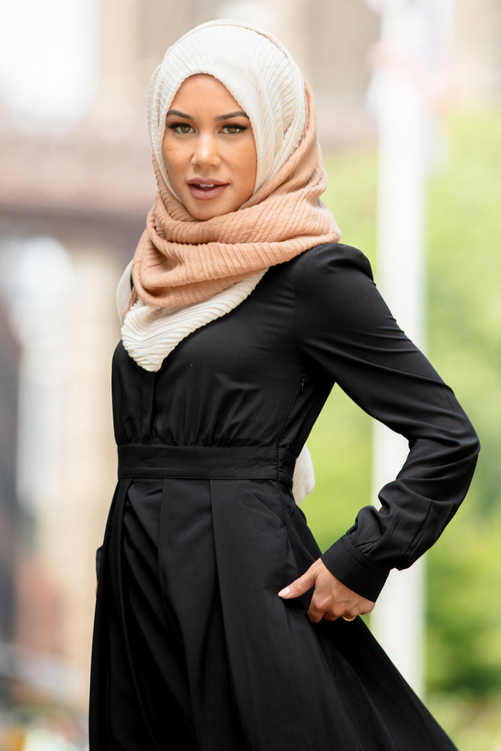 Woman in black dress and hijab showcasing the Black Lattice Abaya Maxi Dress