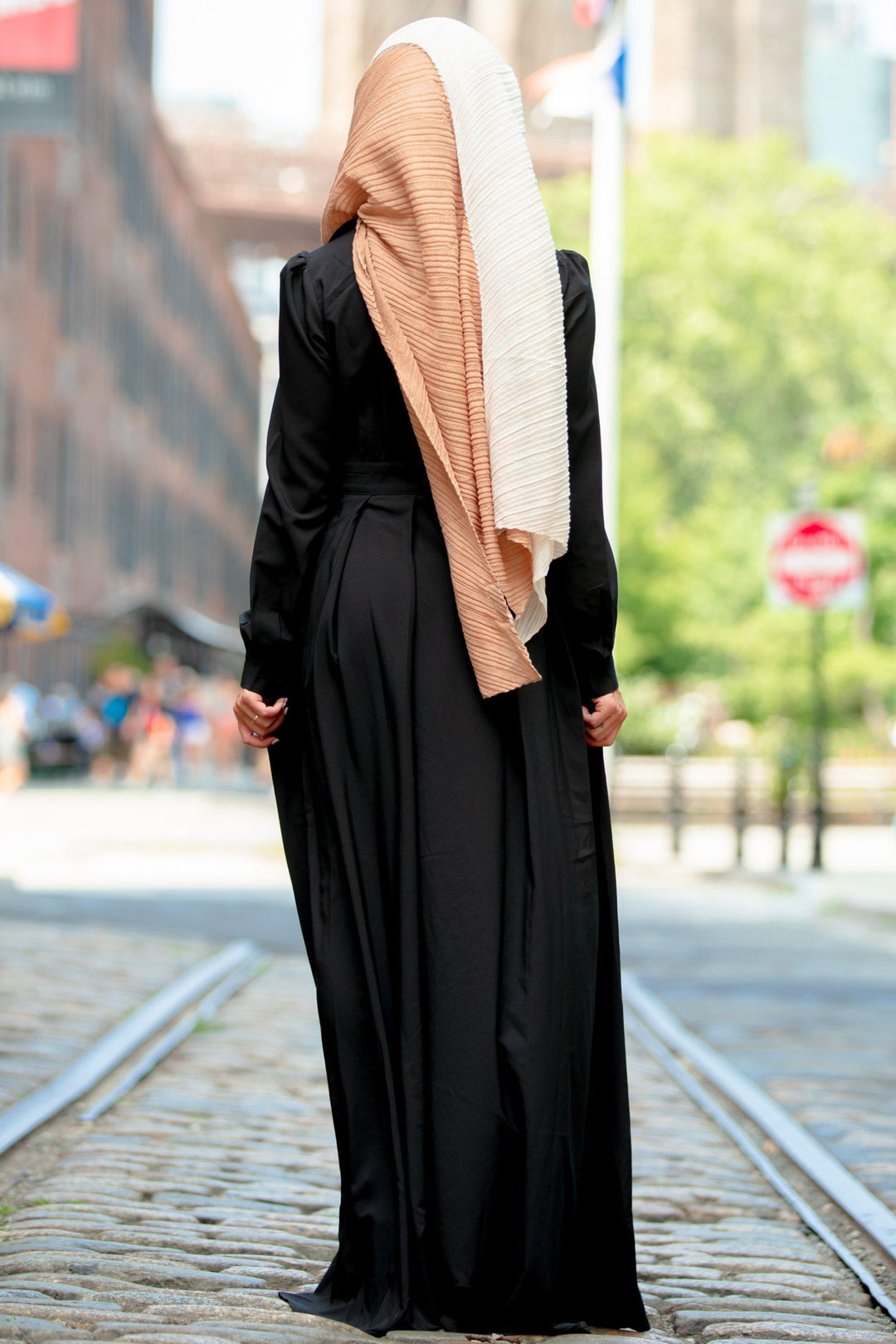 Woman in black dress with two-tone hijab showcasing Black Lattice Abaya Maxi Dress