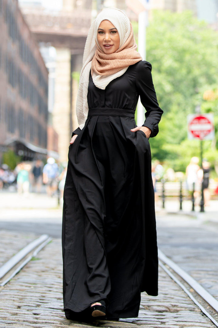 Elegant black lattice abaya maxi dress styled with a matching hijab for modest fashion