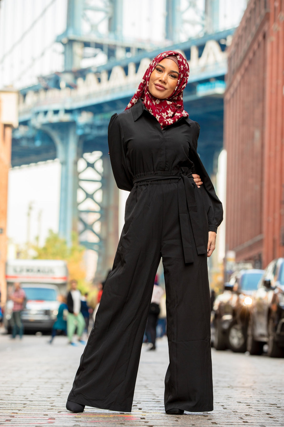 Stylish black jumpsuit paired with a floral hijab for a chic look on clearance