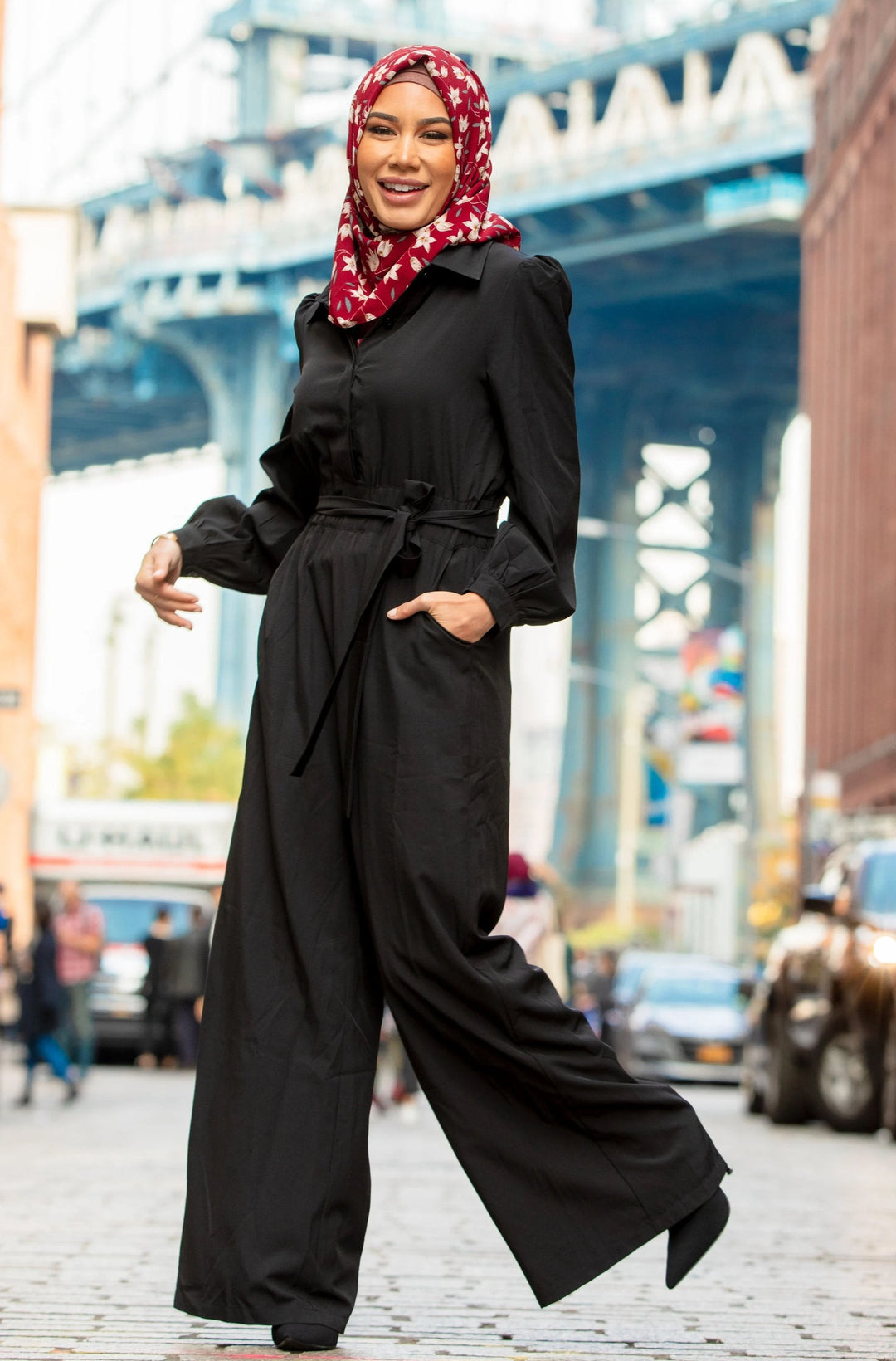 Black Lattice Jumpsuit styled with a vibrant red headscarf for a chic look