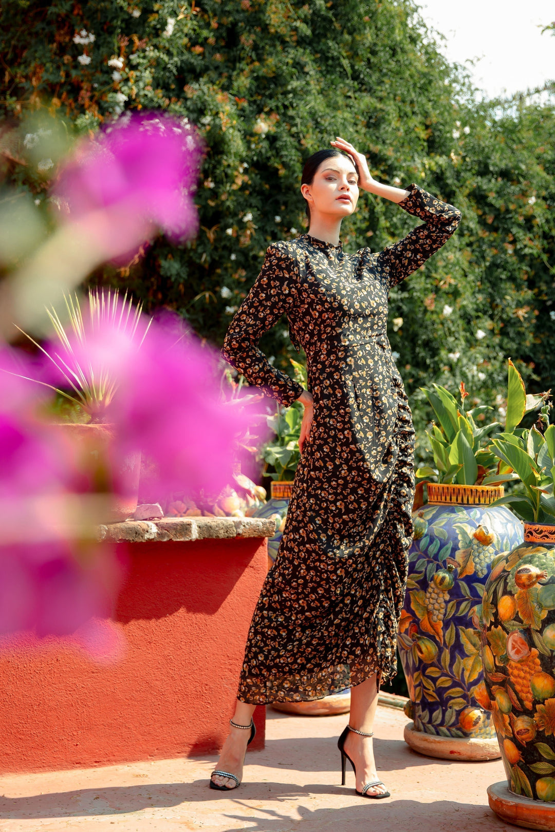 Black Ruched Floral Long Sleeve Maxi Dress featuring a vibrant floral print and elegant design