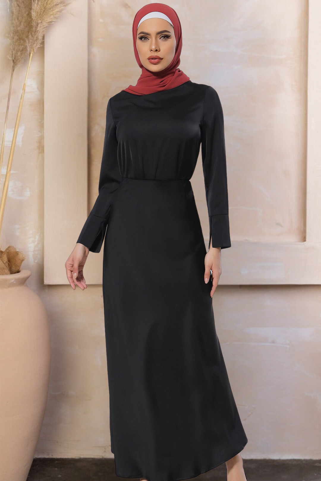 Elegant black long-sleeved dress paired with a chic red hijab in stylish skirt set