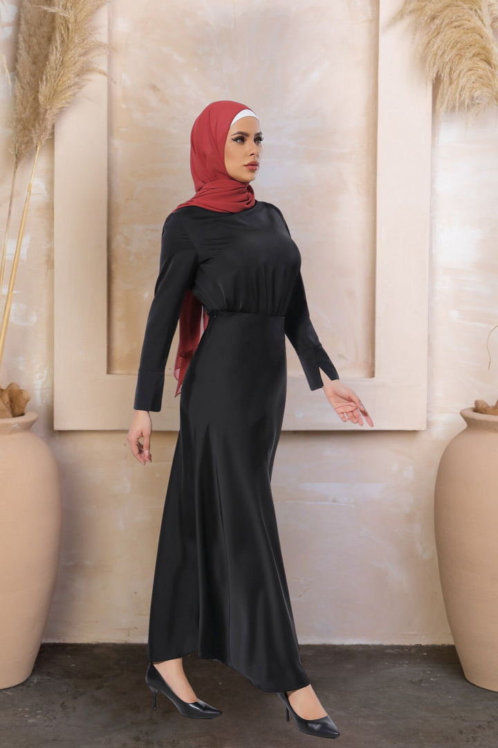 Woman in black satin long sleeve skirt set with red hijab, elegant and stylish look