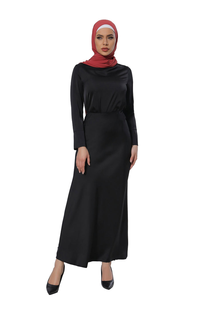 Woman in black dress and red hijab showcasing a Satin Long Sleeve Skirt Set