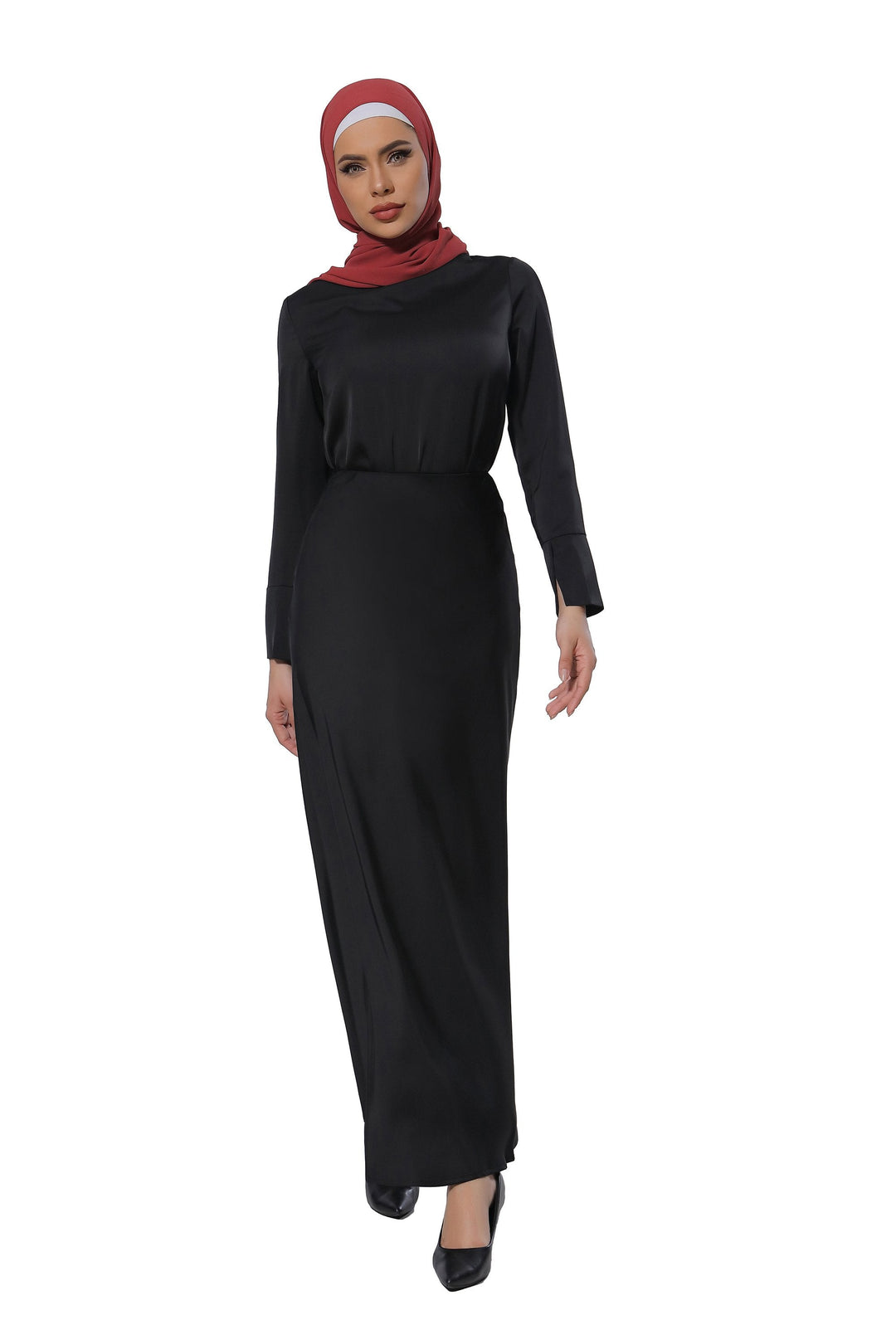 Woman in black dress and maroon hijab wearing satin long sleeve skirt set